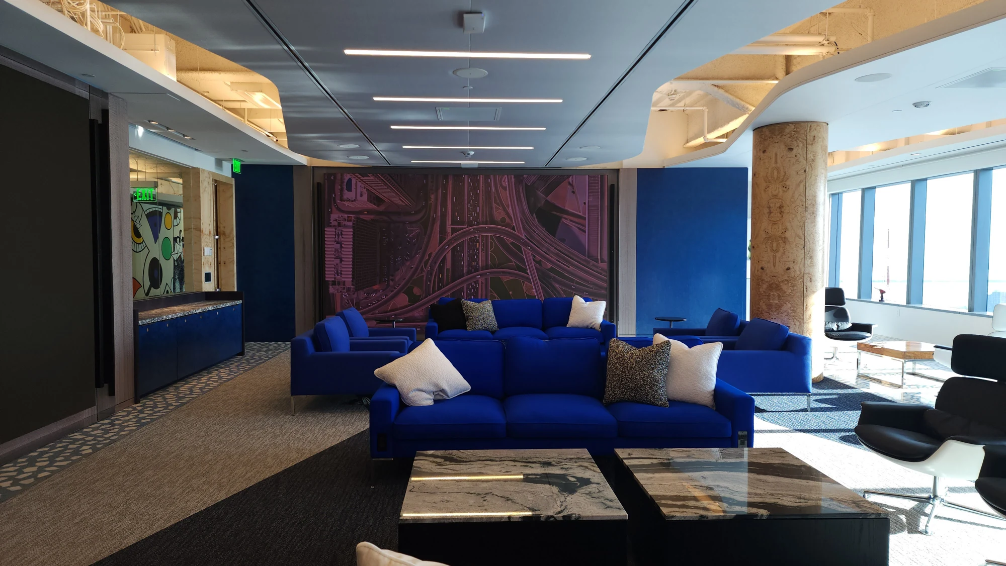 Blue lounge seating and sculpted ceiling details featured on Walker’s current website