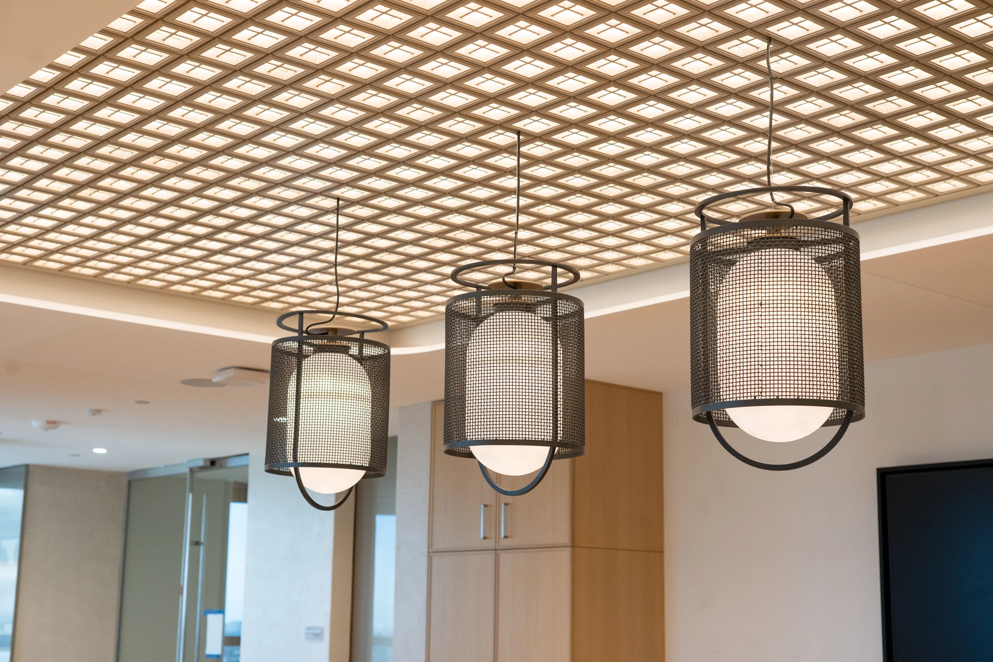 Lattice ceiling and hanging light fixtures at Winston & Strawn